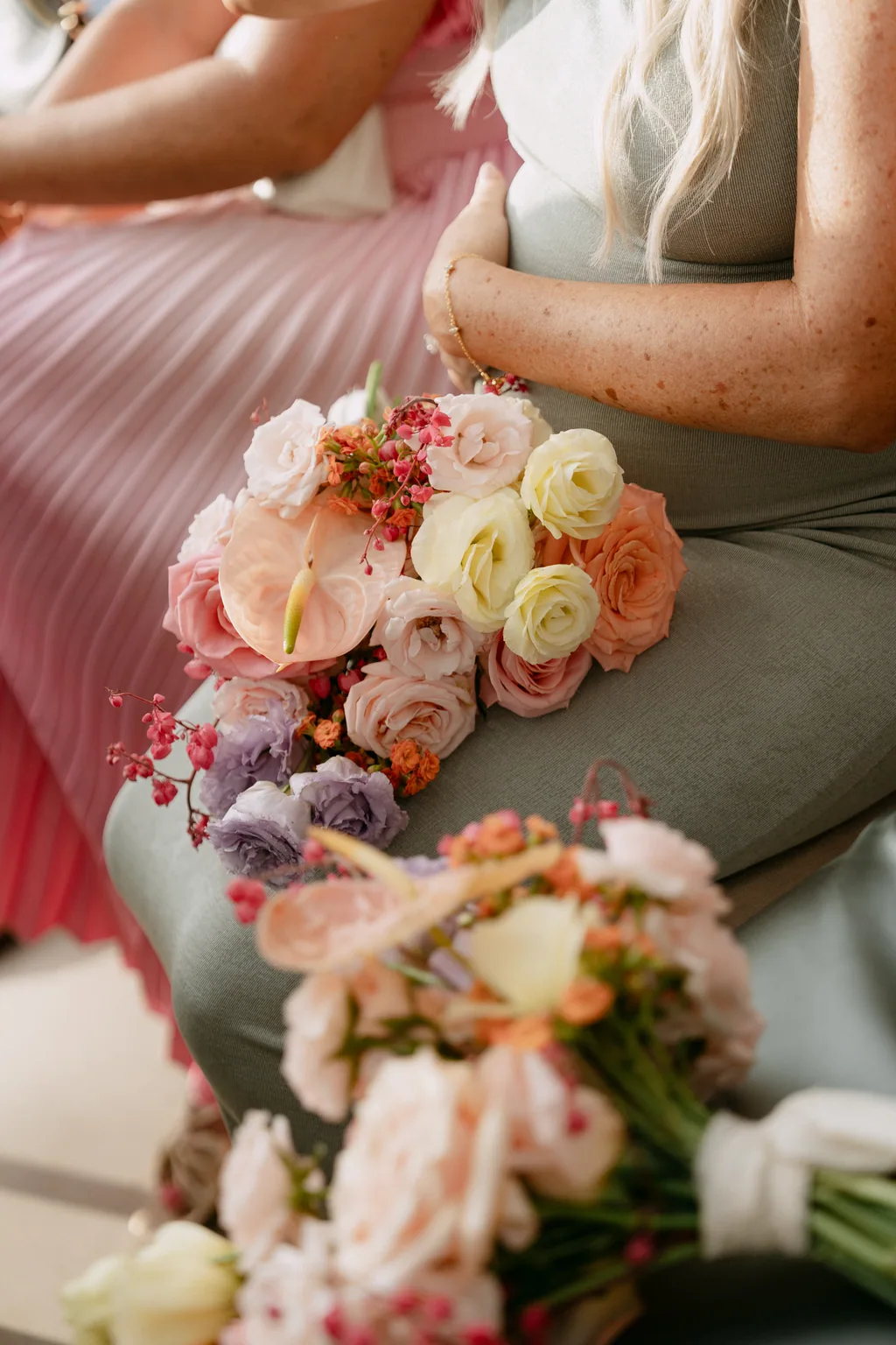 A bouquet held in a lap during the ceremony
