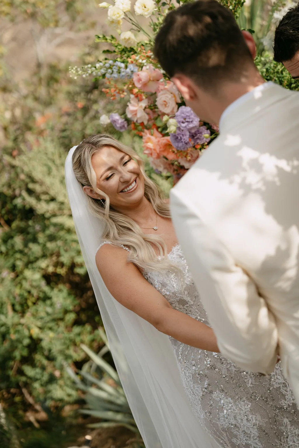Bailey laughing at the altar during the ceremony