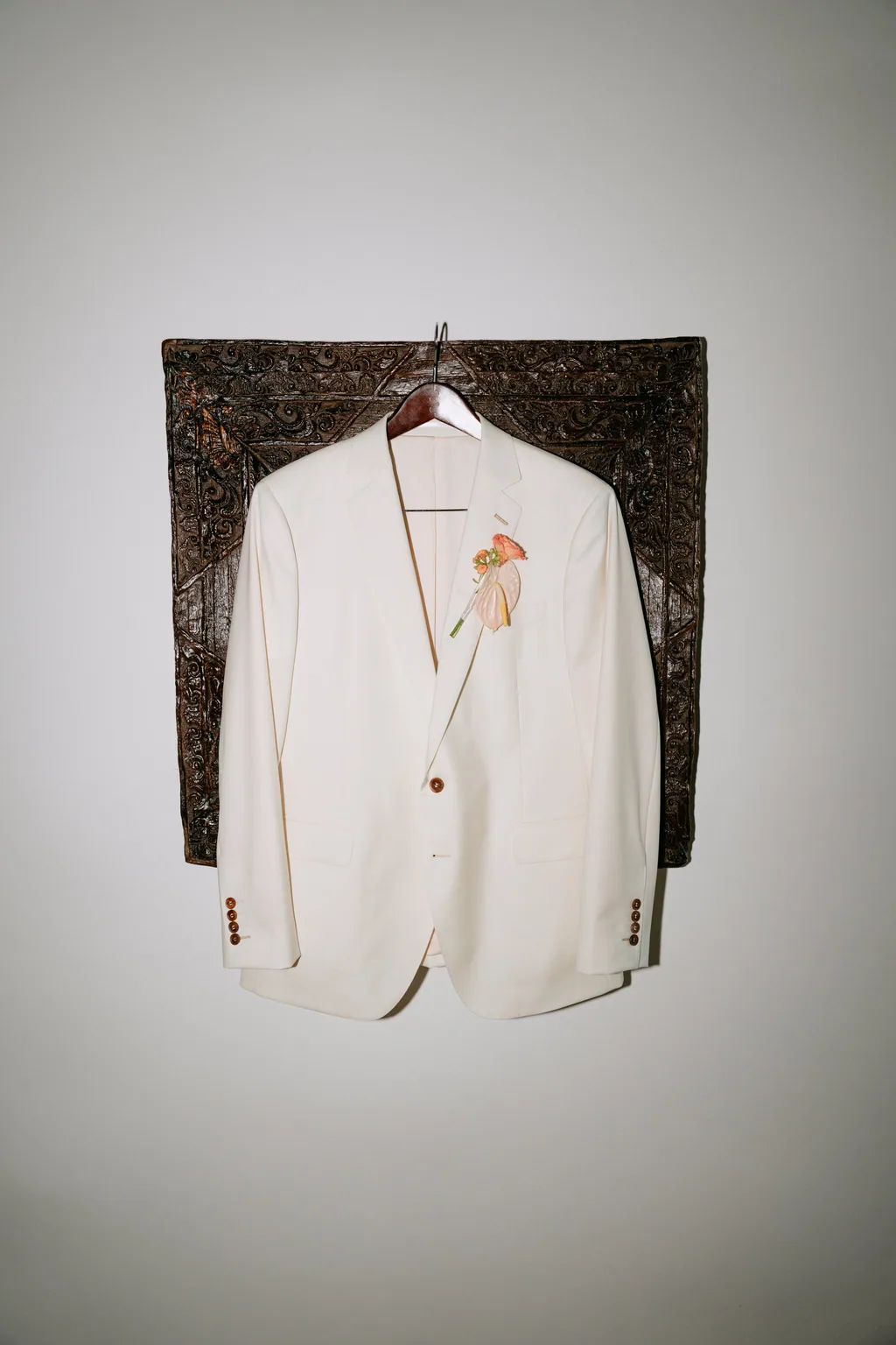 Matthew's jacket hanging against the steel wall before the wedding