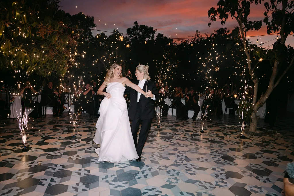 Their first dance on the tiled floor under the sunset
