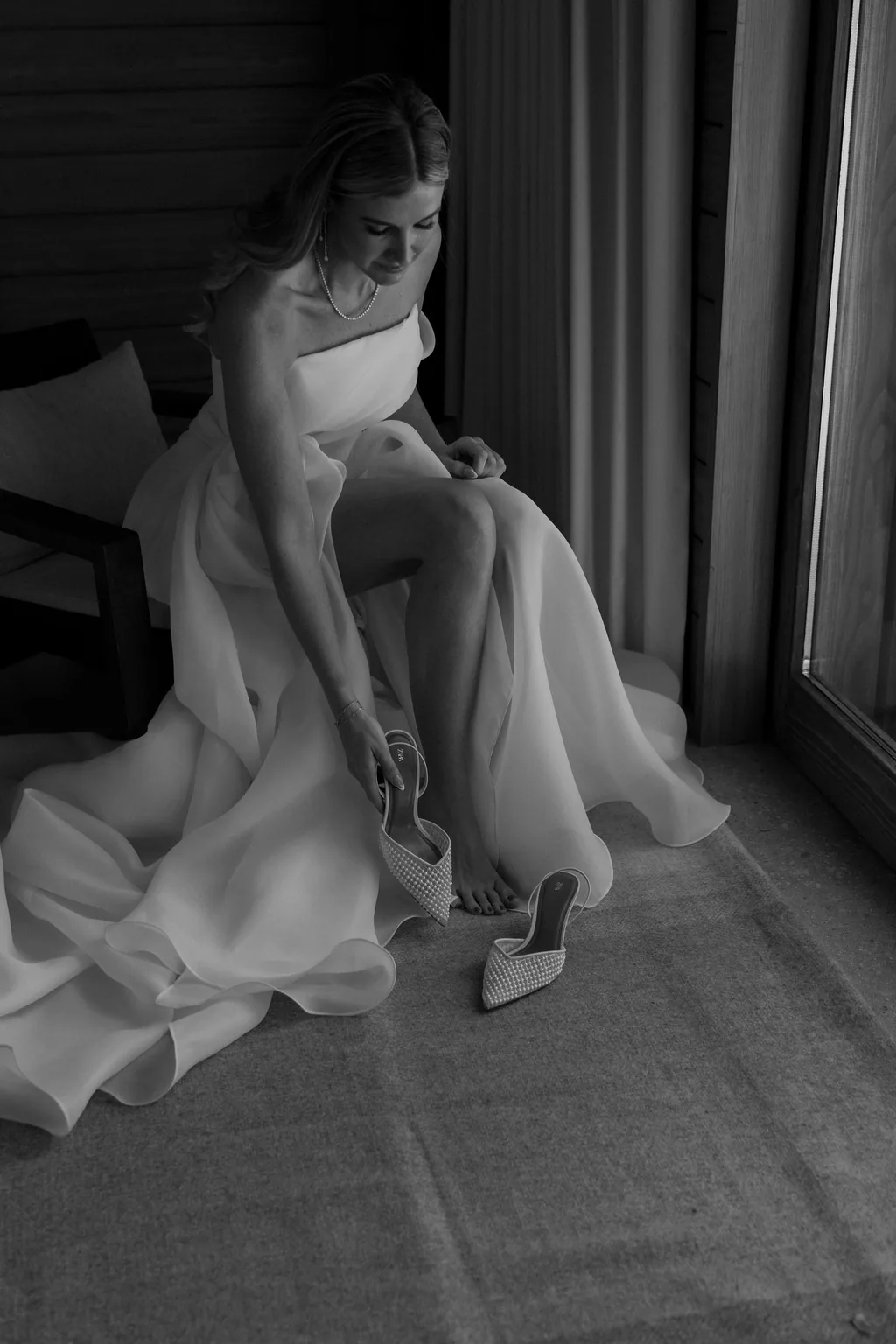 Sitting at the window in the gown, in black and white