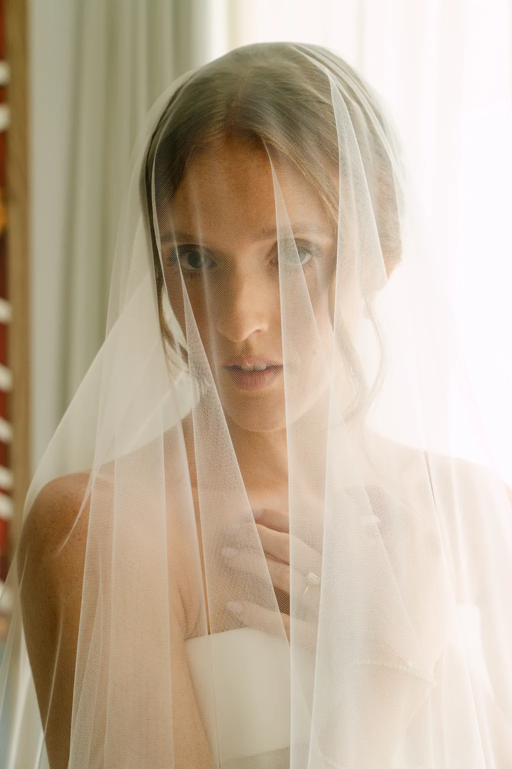 Lauren under her veil in the warm afternoon light