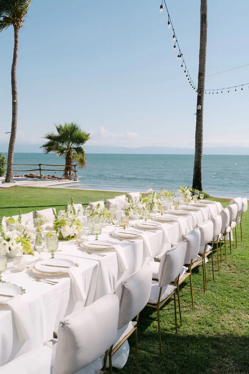 The long table set by the water at golden hour