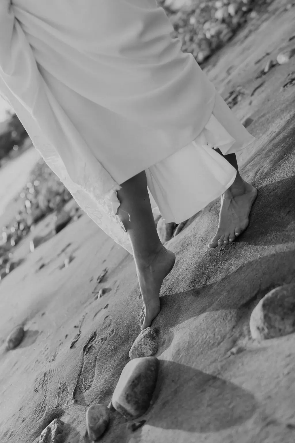 Bare feet and the veil on the rocks, black and white